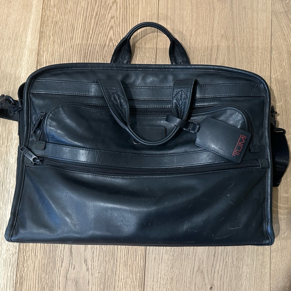 Black leather Tumi brief case